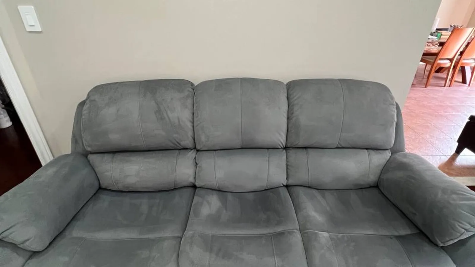 A grey fabric sofa after hot-water extraction cleaning